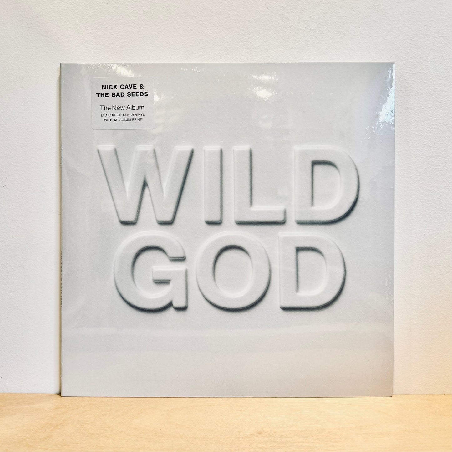 Nick Cave & The Bad Seeds - Wild God. LP [Ltd. Ed. Clear Vinyl w. 12" Album Print]