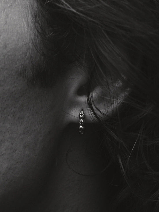 Temple of the Sun - Ayana Huggies Earrings - Silver / Topaz